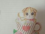 坐在茶杯里的小猫