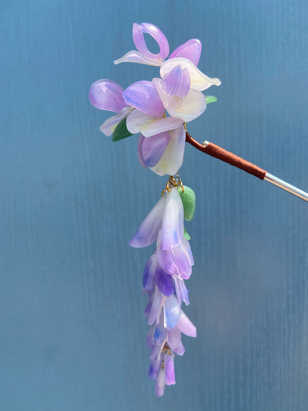 紫藤的小花瓣弄得多是很好看，还有摩擦产生的叮叮当当的声音。