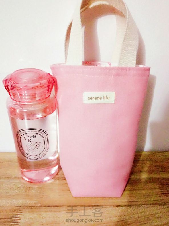 简单的布艺，粉粉的水壶袋