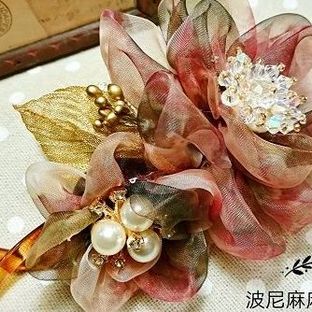 和风暖阳雪纱花朵扭扭夹